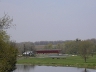 View of covered bridge in the distance with the Grand River in the foreground